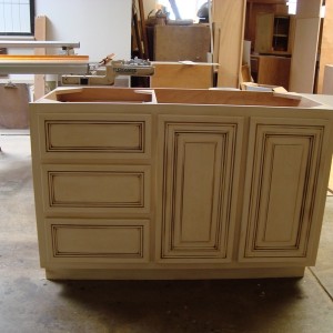 Bathroom vanity cabinet with antique glaze.